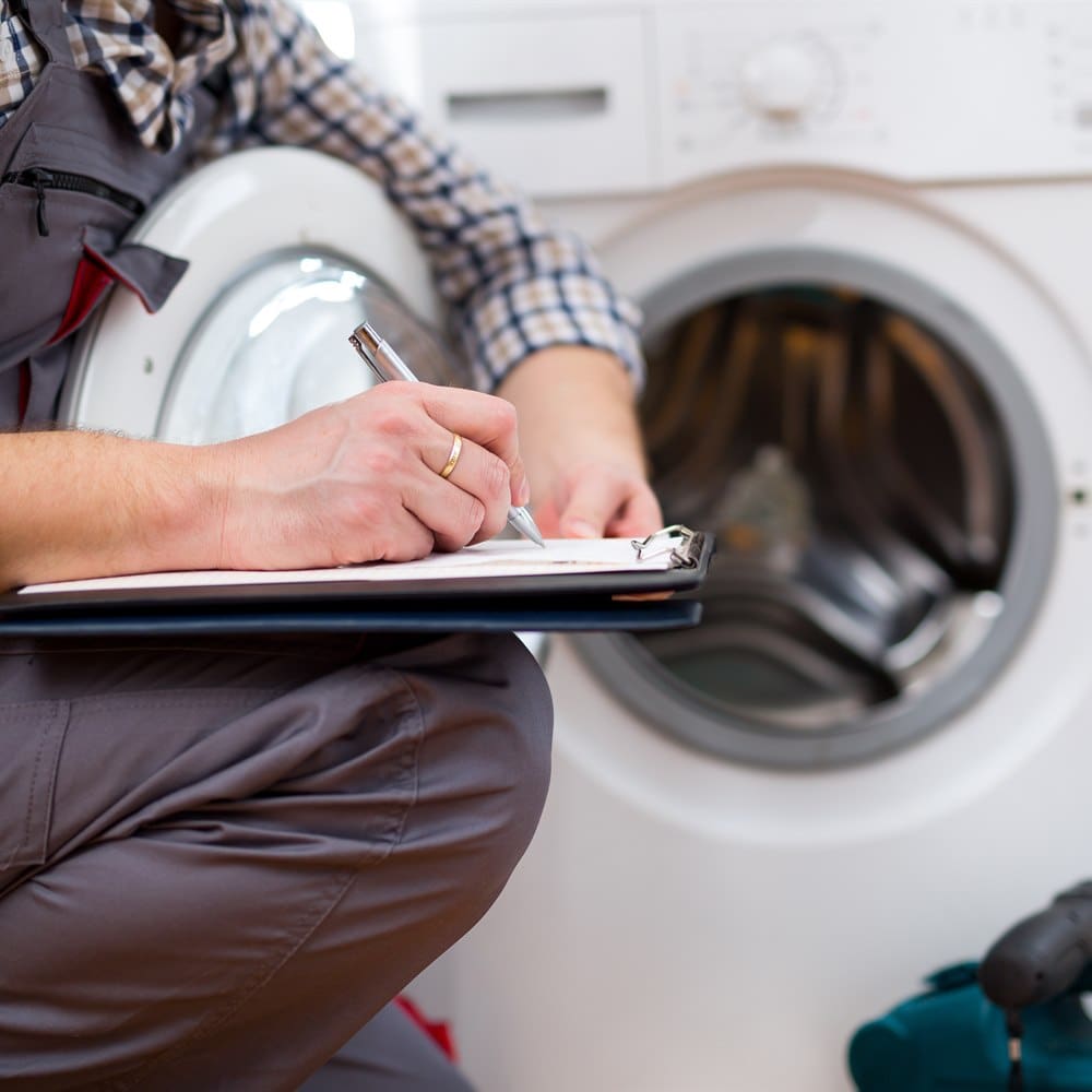 Appliance technician inspecting