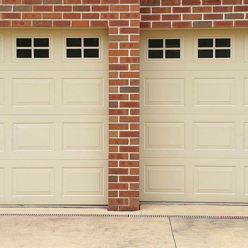 double-garage-doors-with-windows-in-brick-facade Double garage doors with windows in brick