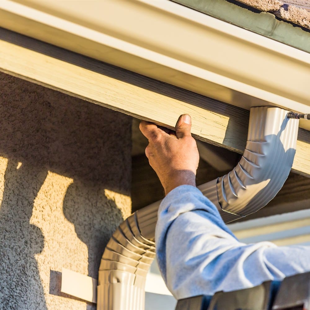 Installing gutter downspout elbow