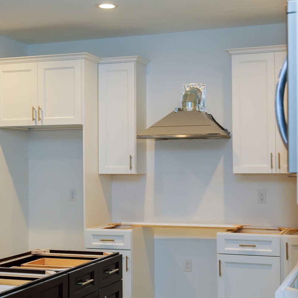 Kitchen renovation project with new white cabinets