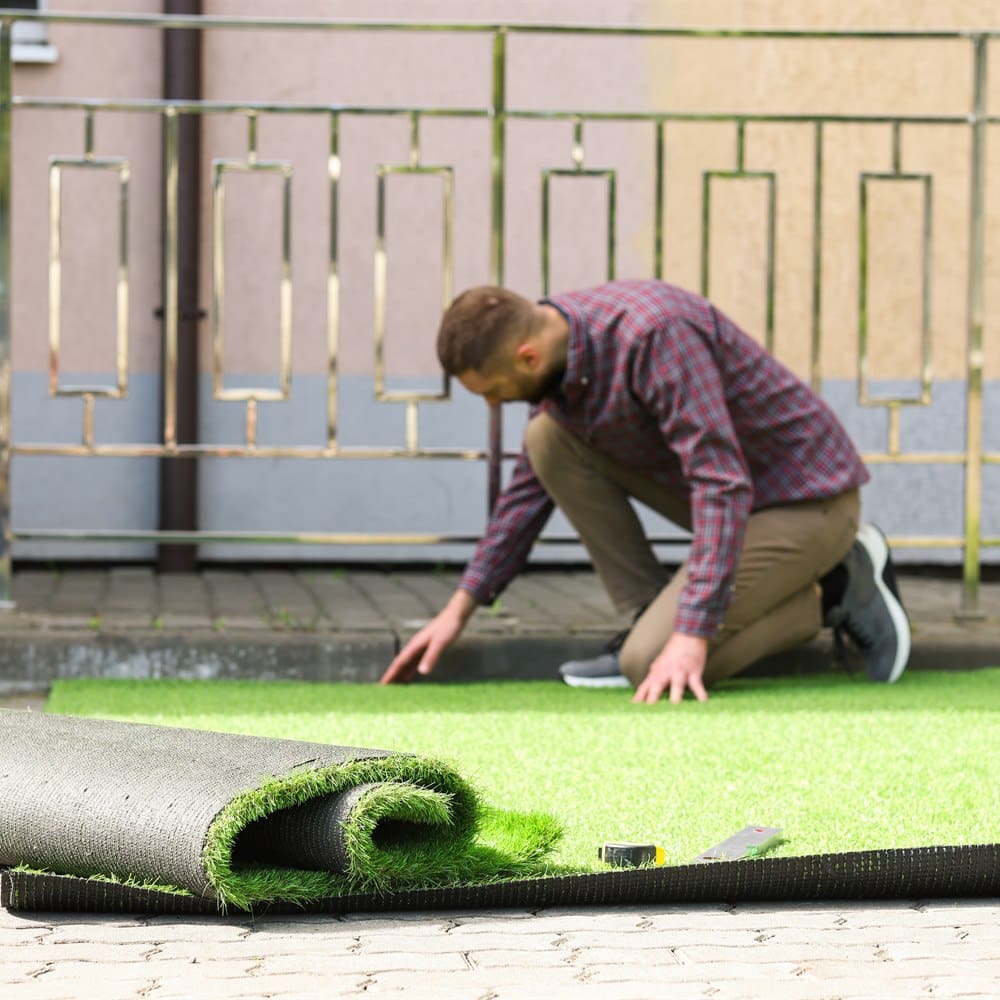 Man installing artificial turf
