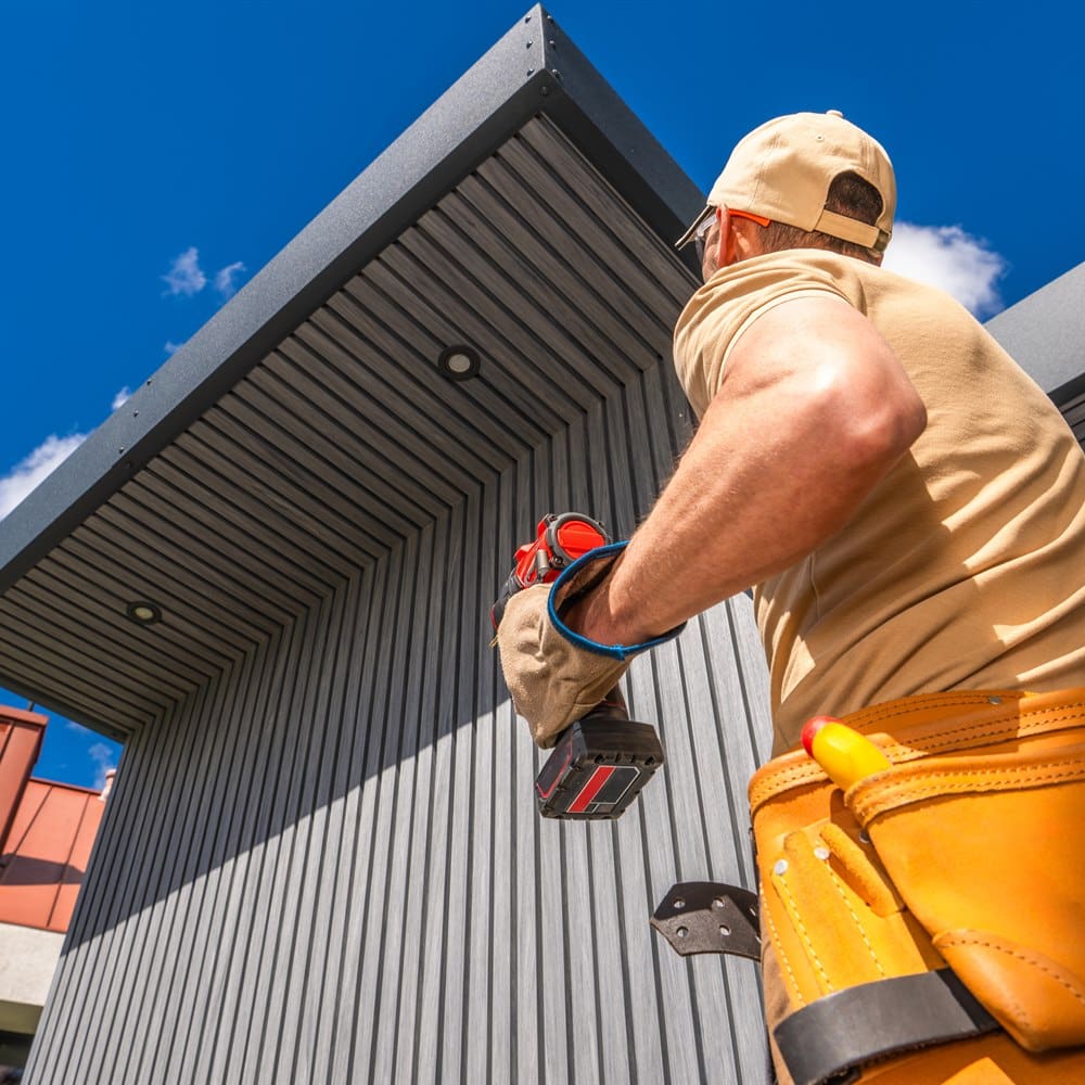 Professional construction worker installing modern