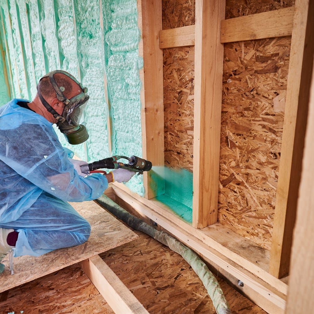 spraying-foam-insulation-into-a-wall Spraying foam insulation into a wall