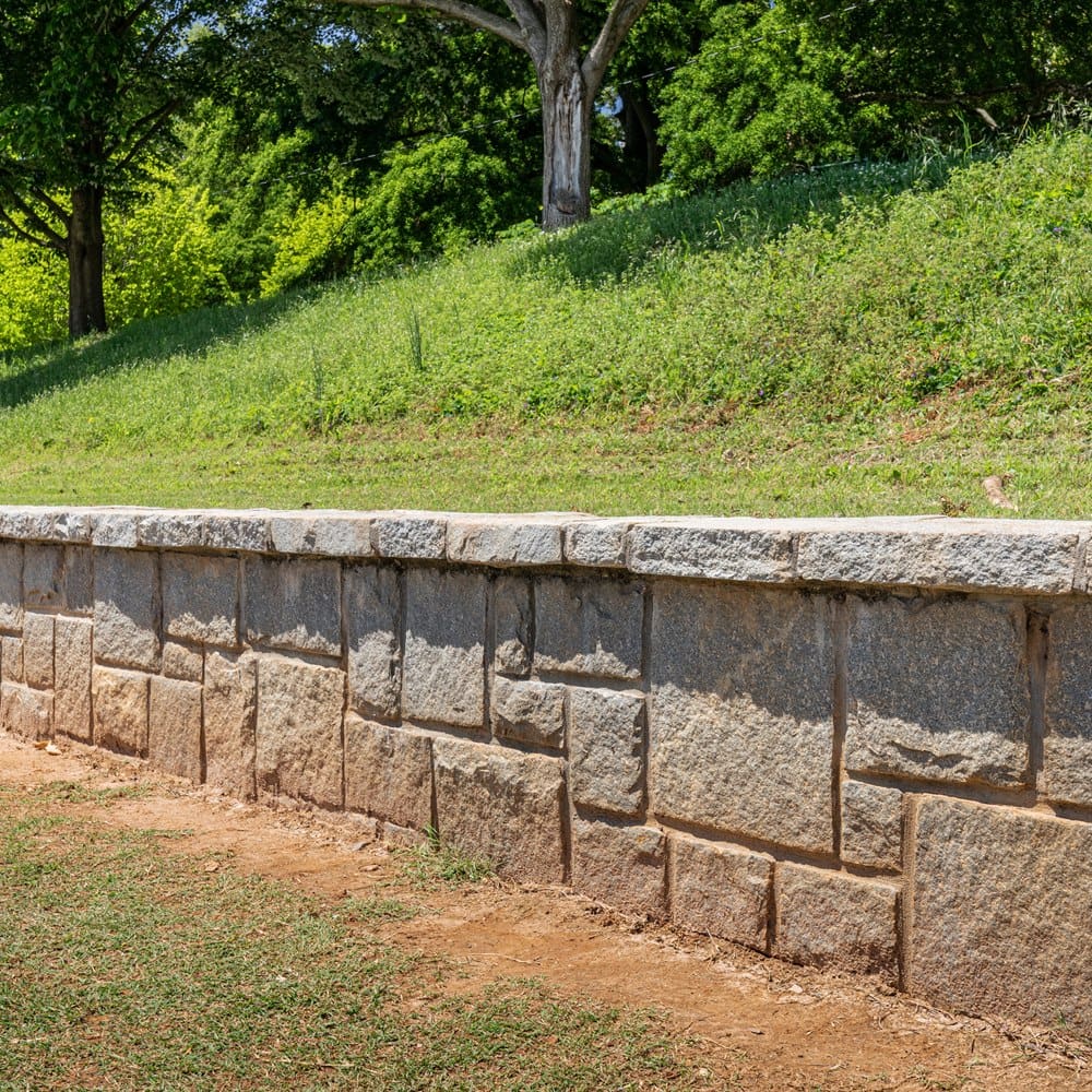 stone-retaining-wall-along-a-slope Stone retaining wall along a slope